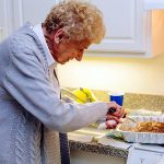 Resident in her apartment kitchen