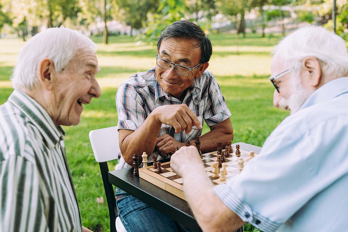 Joyous seniors playing chess